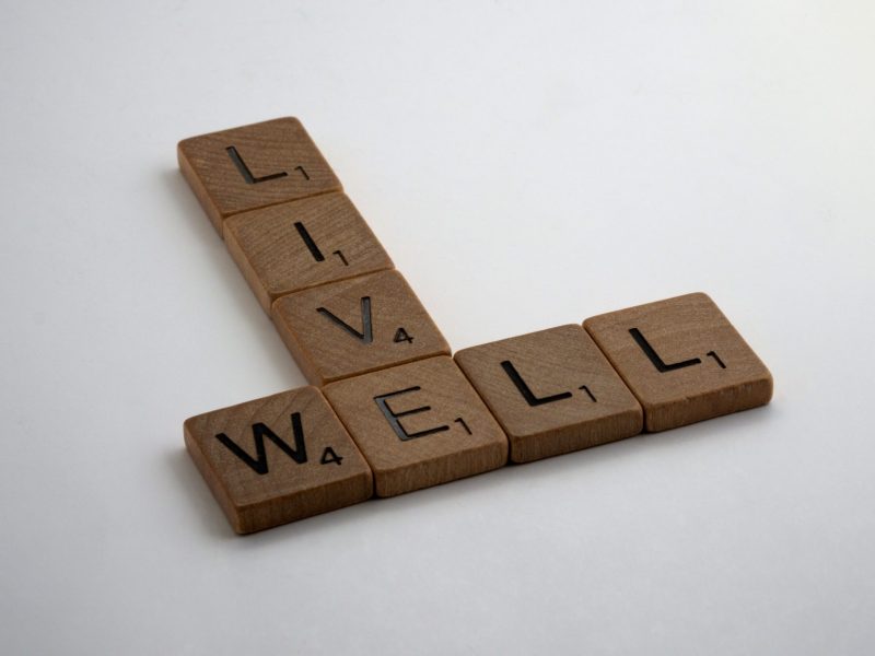 wooden-brown-letter-tiles-on-white-surface