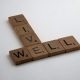 wooden-brown-letter-tiles-on-white-surface